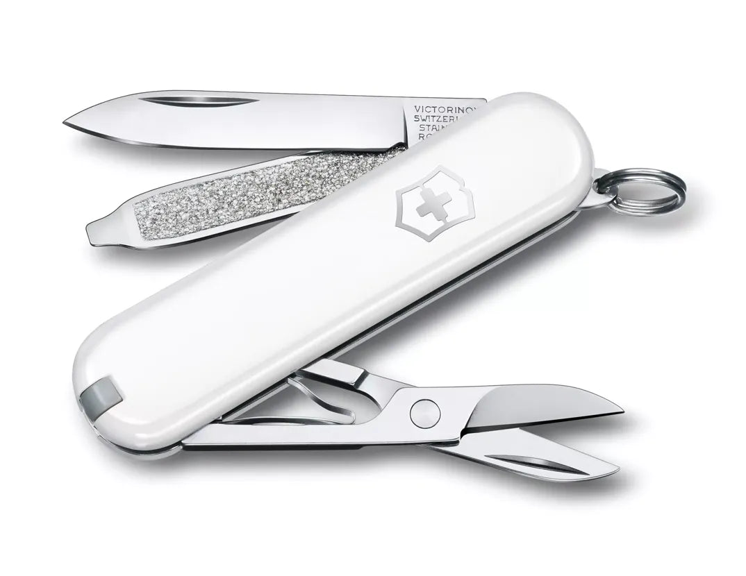 white Swiss army knife with several tools partially opened