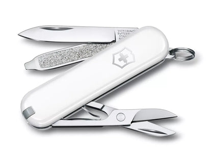 white Swiss army knife with several tools partially opened