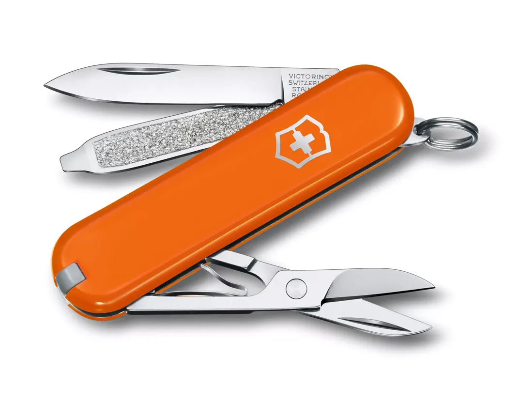 orange Swiss army knife with several tools partially opened