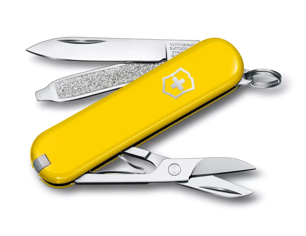 yellow Swiss army knife with several tools partially opened