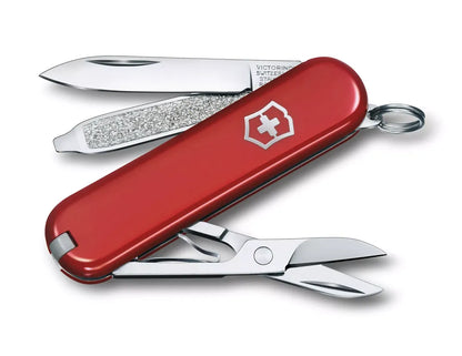 red Swiss army knife with several tools partially opened