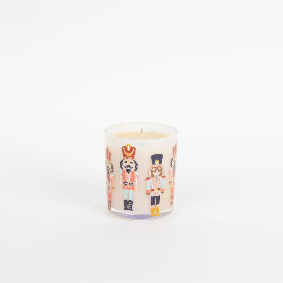 Candle with nutcracker design on a white background