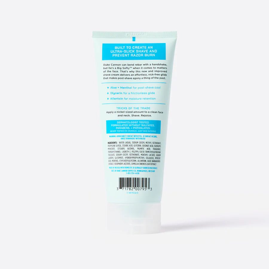 Back view of a tube of  shave cream with text on a white background