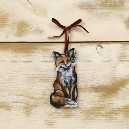 flat fox ornament with a holly branch around one ear