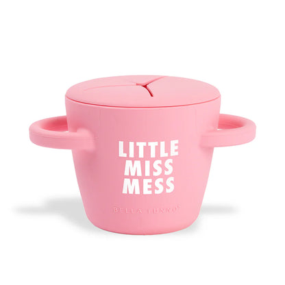 pink silicone snack holder with "little miss mess: printed on it in white.