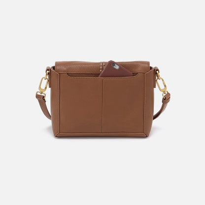 back view of the austin flap cross body bag in timber brown