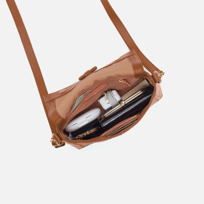 Interior view of warm honey Austin flap crossbody