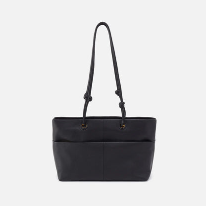 softie tote in black back view with long handles and large exterior pocket