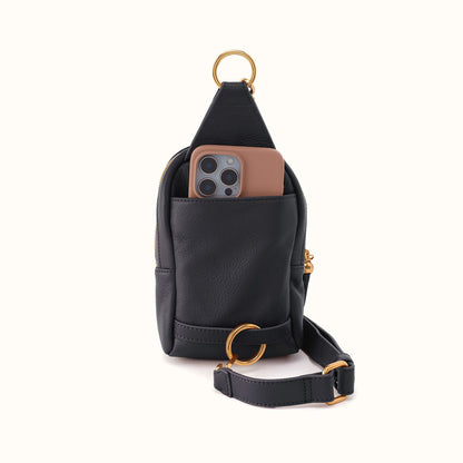 back view of the small fern sling bag  in black