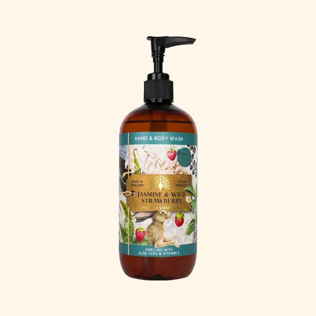 Hand and body wash bottle with floral and berry label on a white background