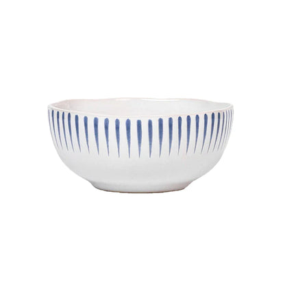 white cereal bowl with vertical blue stripes near rim on a white background