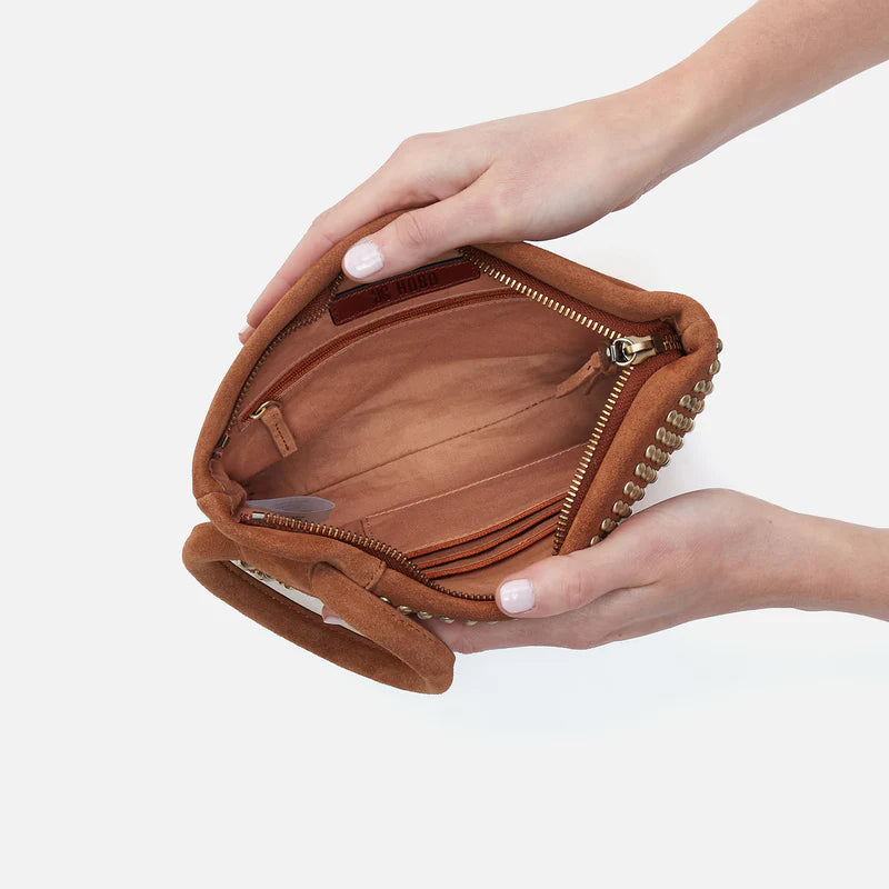 hands holding open Maggie Clutch showing interior.