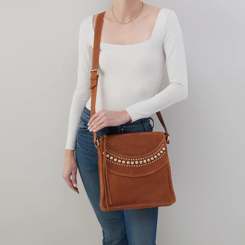 person wearing jeans and a white top with Mystic Crossbody over their shoulder.