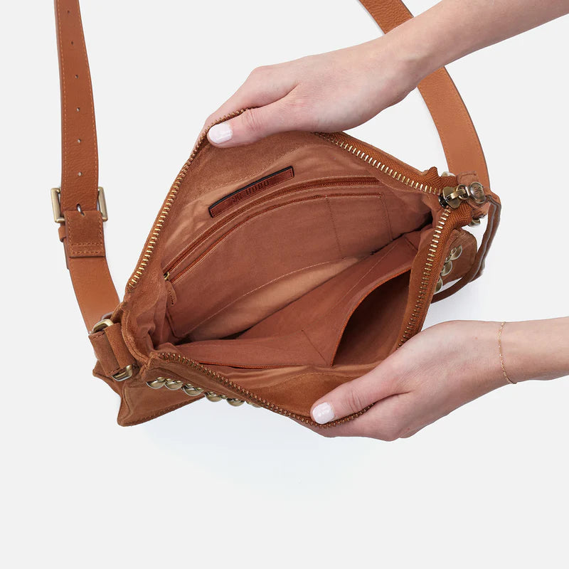 hands holding open Mystic Crossbody showing interior.