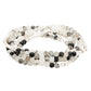 4.5 millimeter tourmaline quartz beads interspersed with gold and silver beads wrapped four times to form a bracelet and displayed on a white background