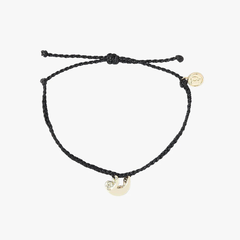 Pura Vida braided black cord bracelet with gold sloth charm hanging from bracelet and a Pura Vida Charm