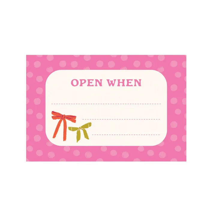 sample of note sheet with pink boarder, 2 bows in the corner, and "open when" printed at the top.