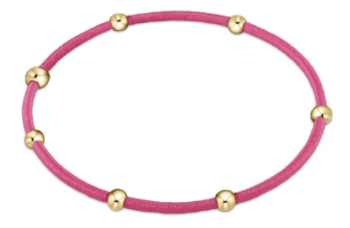 bright pink hair tie bracelet with gold beads
