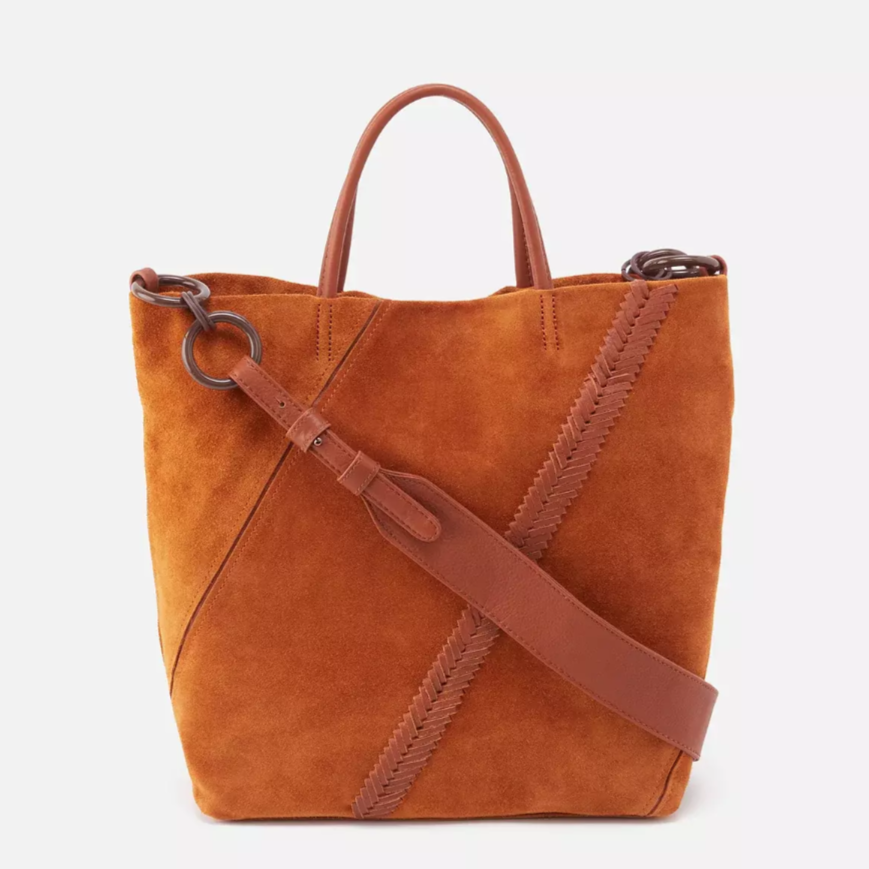 cognac colored suede tote bag on a white background.