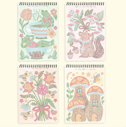 4 colorful line drawing notepads with floral and nature-themed designs
