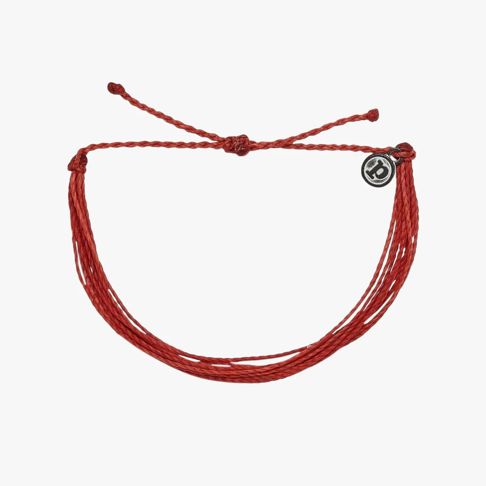 Pura Vida multi strand corded red bracelet with a Pura Vida logo charm