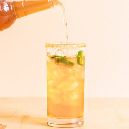 syrup being poured into a glass