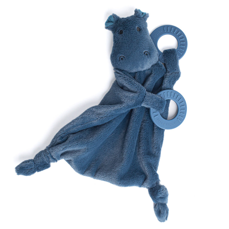 blue hippo buddy teether with teething ring draped across it.
