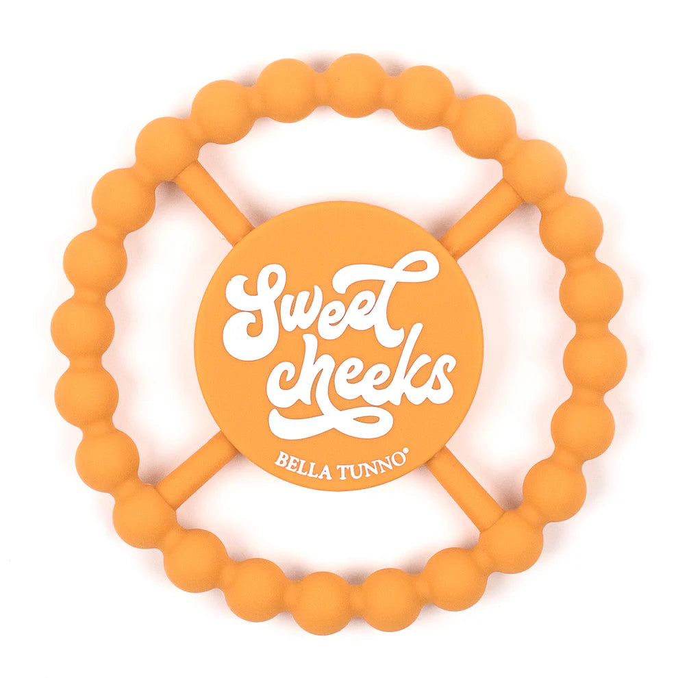 orange silicone teether with sweet cheeks printed in the middle.