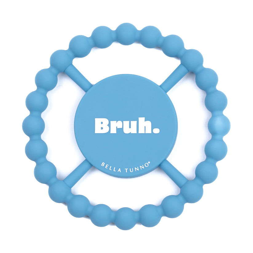 blue silicone teether with "bruh" printed in white in the center.