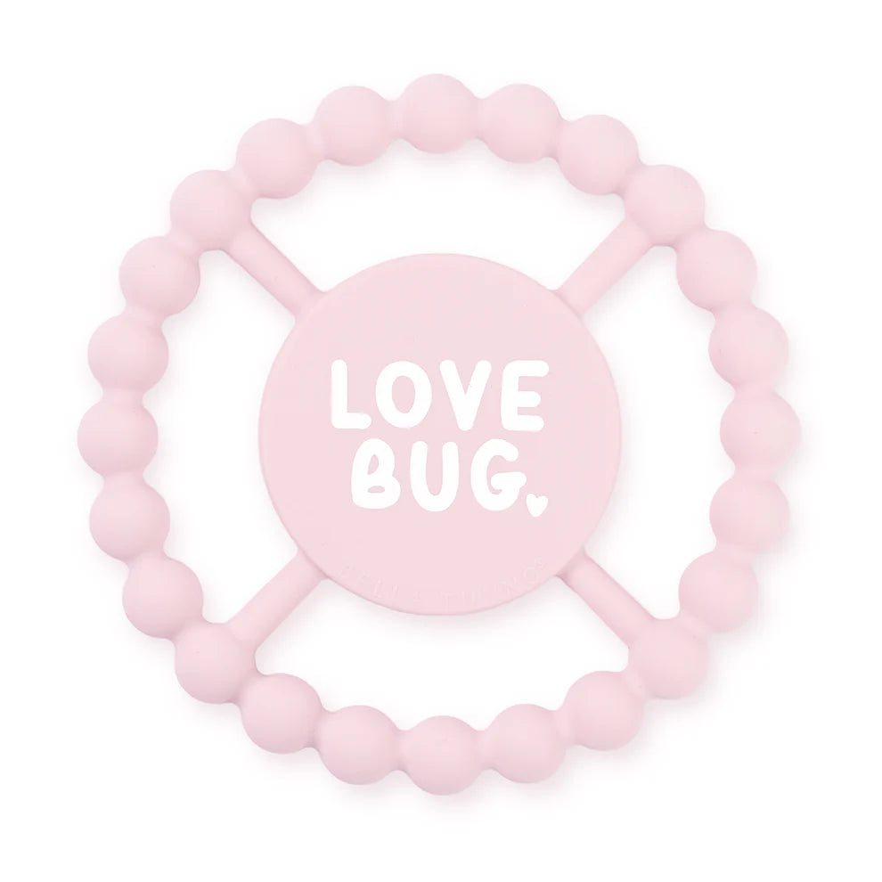 pink silicone teether with "love bug" written in the center.