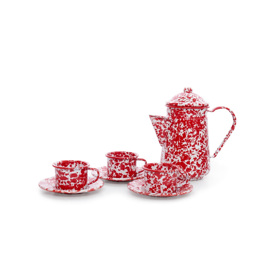 red splatter ware tea set on a white background.