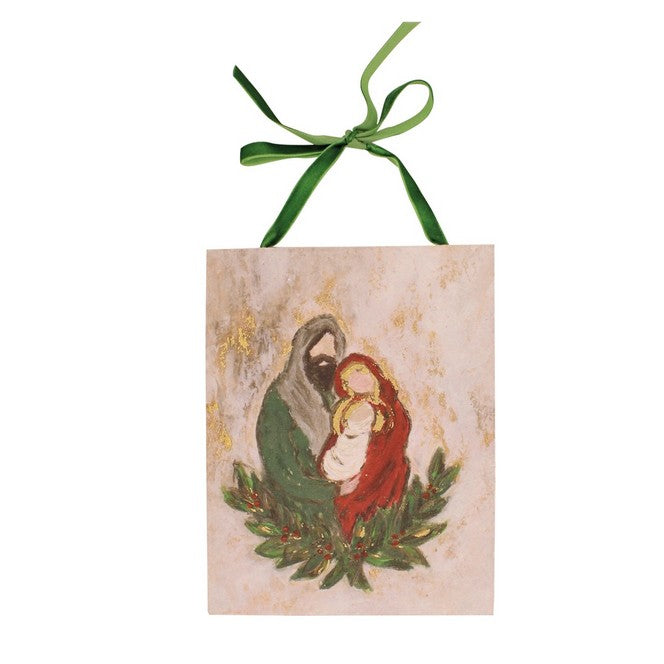 rectangle ornament with a green velvet bow hanger featuring the holy family in colors of red, green and gold