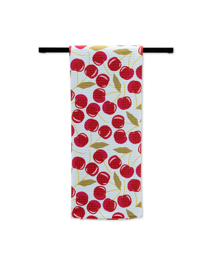 Sweet Cherry Tea Towel folded over a towel bar
