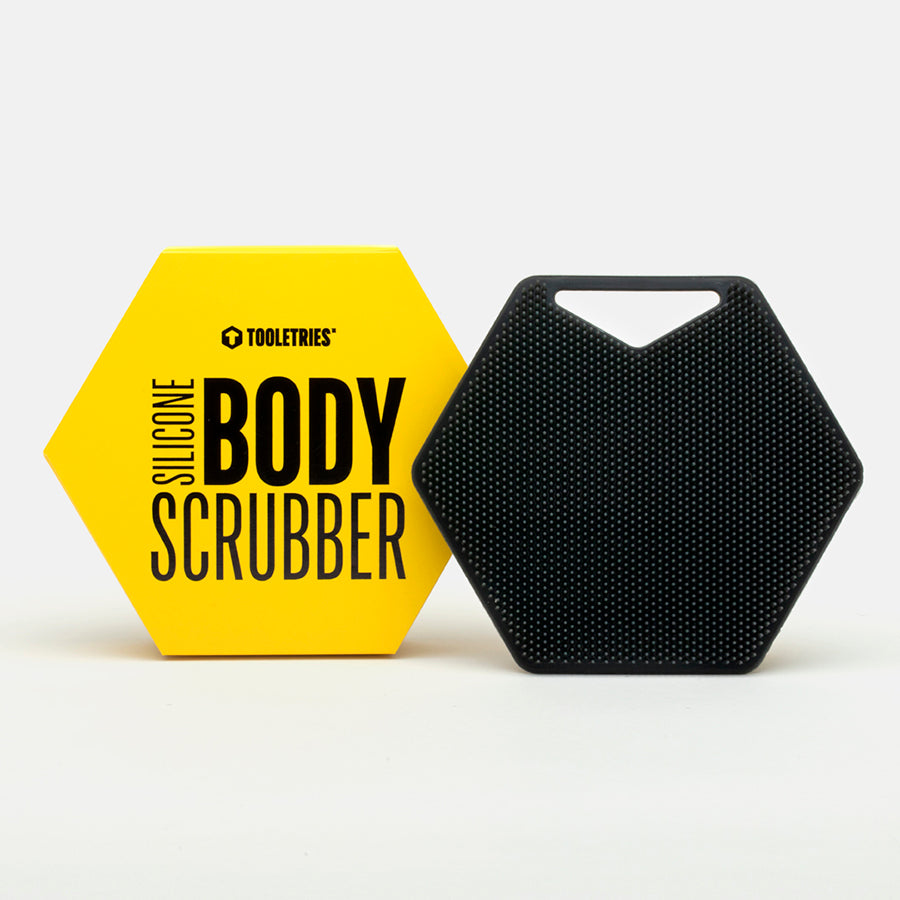 black hexagon scrubber set next to its yellow box packaging.