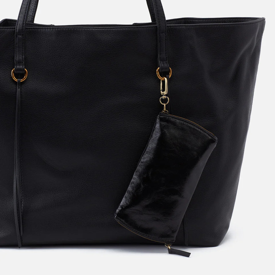 black Spark Glasses Case clp on the handle of a tote bag