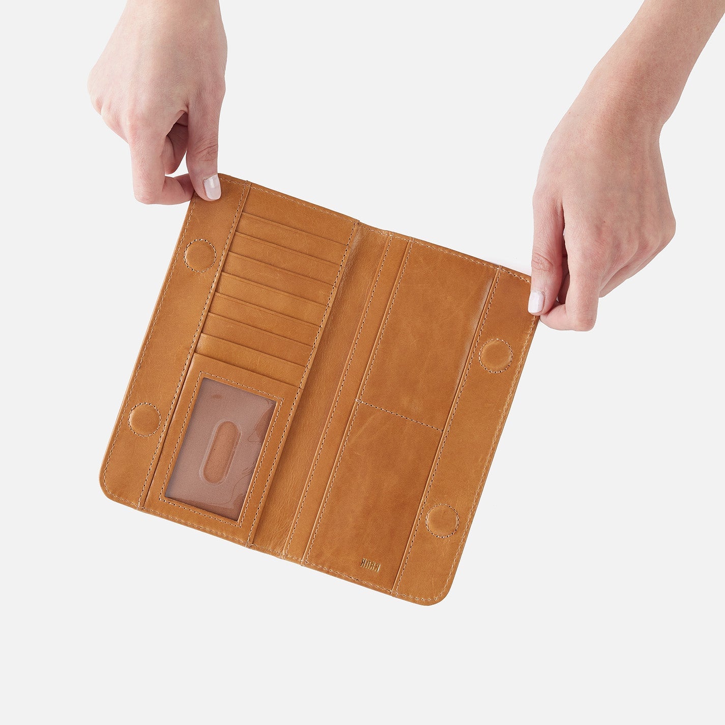 hands holding open natural wallet.