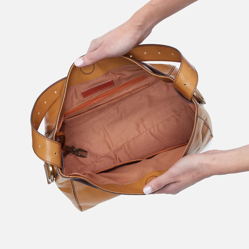 hands holding open natural render bag showing the interior.