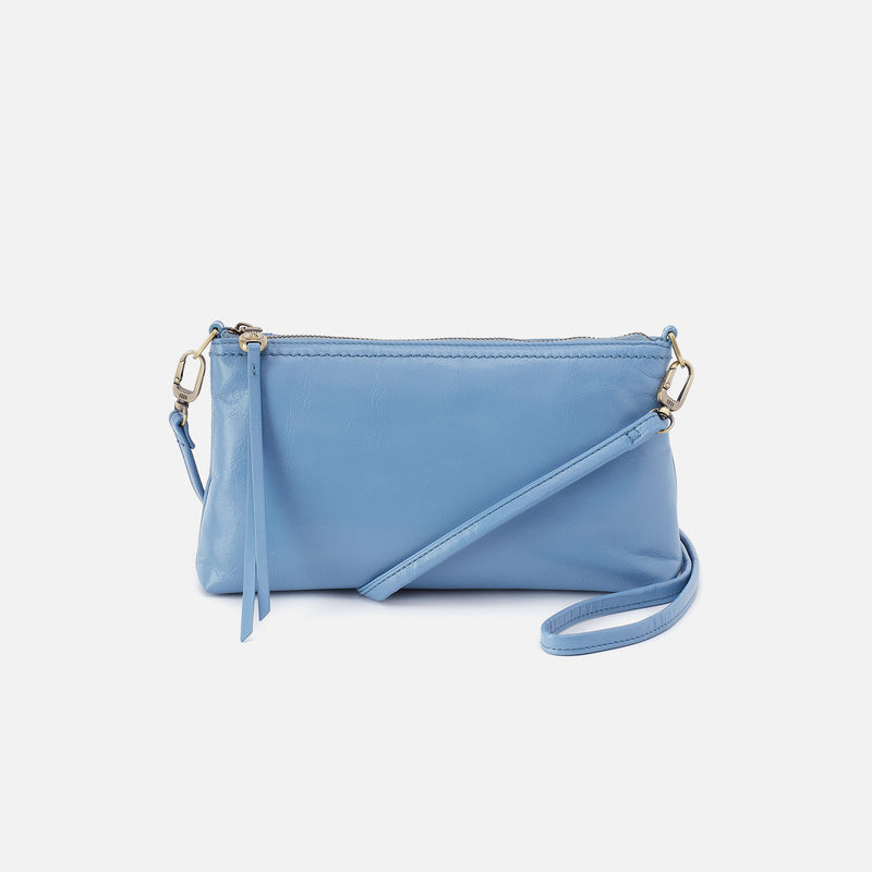 front view of the faded denim darcy convertible crossbody on a white background