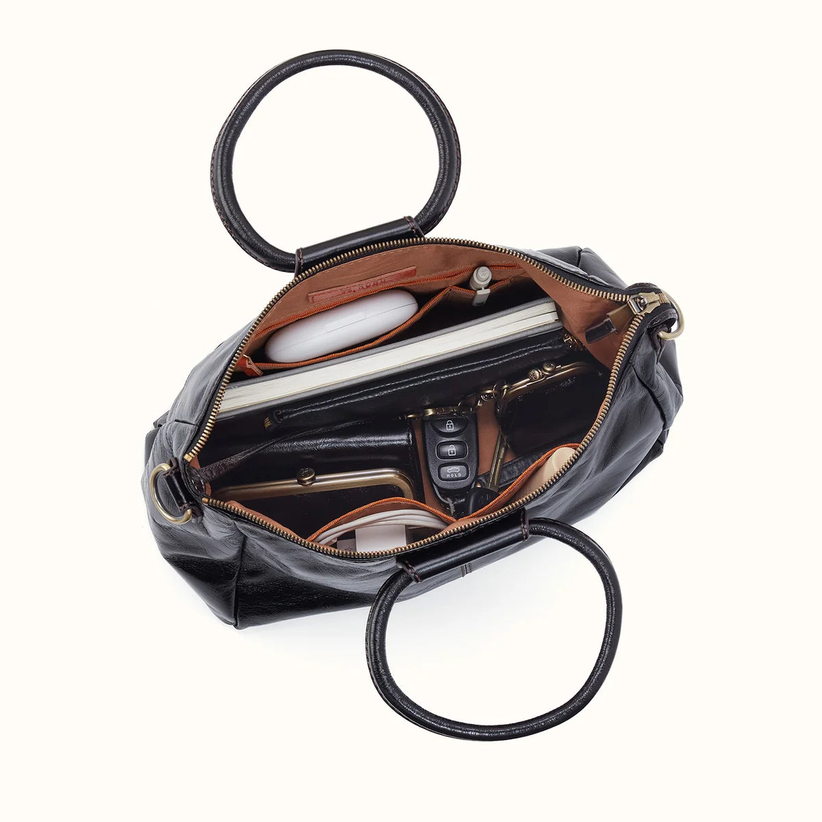 top down view of the medium black sheila on a white background