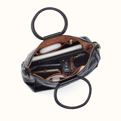 top down view of the medium black sheila on a white background