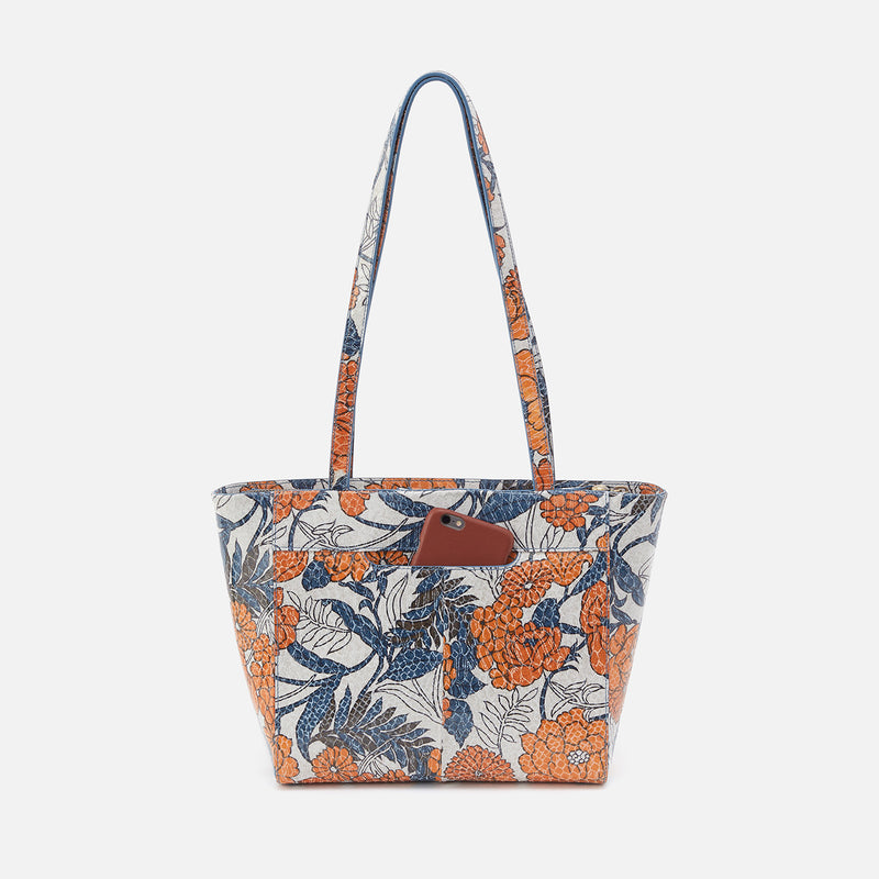 back view of orange blossom Haven Tote with phone in pocket.