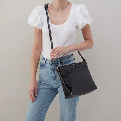 person wearing the romy medium crossbody in black