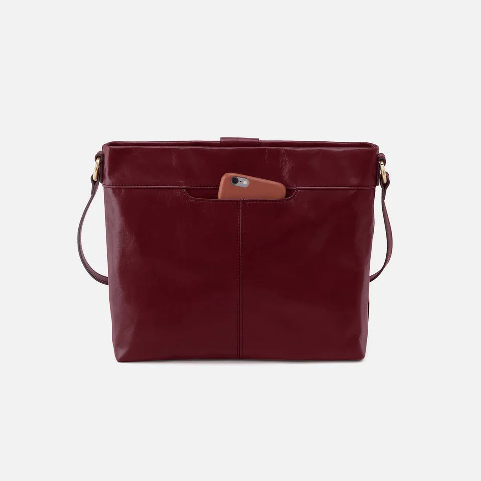 back view of saddle berry Romy Medium Crossbody with hone in pocket