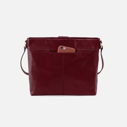 back view of saddle berry Romy Medium Crossbody with hone in pocket