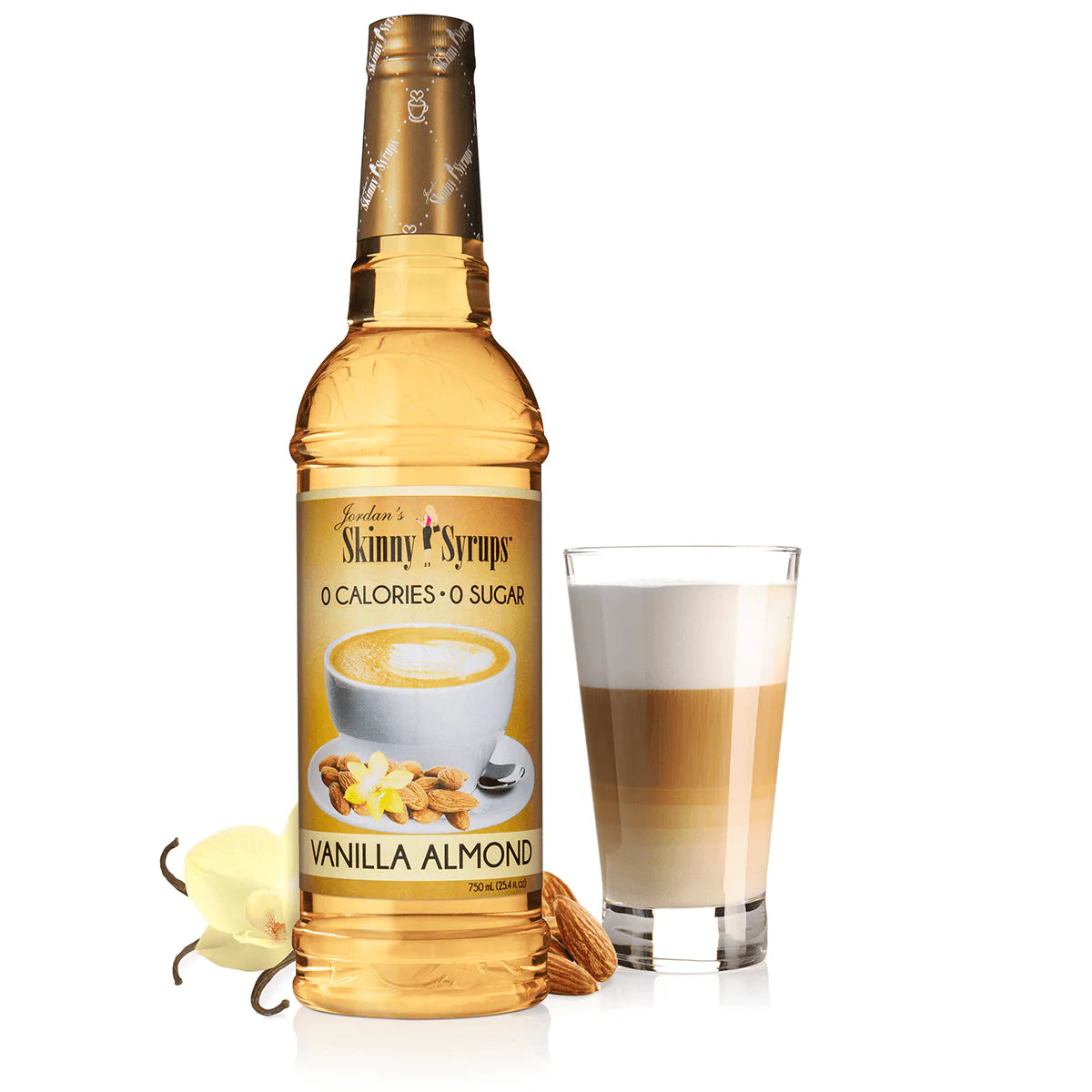 bottle of vanilla almond skinny syrup set next to a coffee beverage.