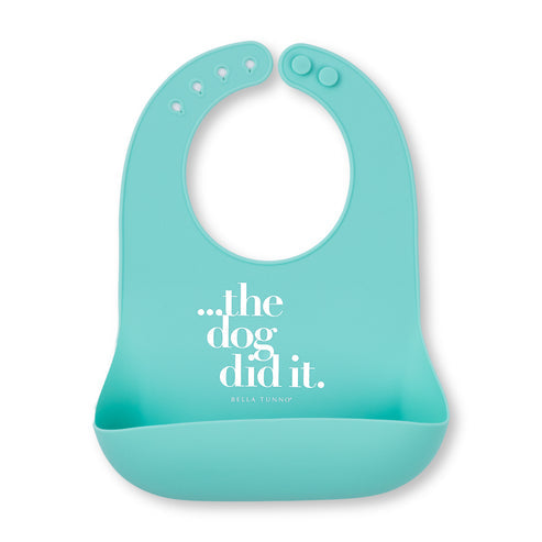 Turquoise bib with 'the dog did it' text on a white background