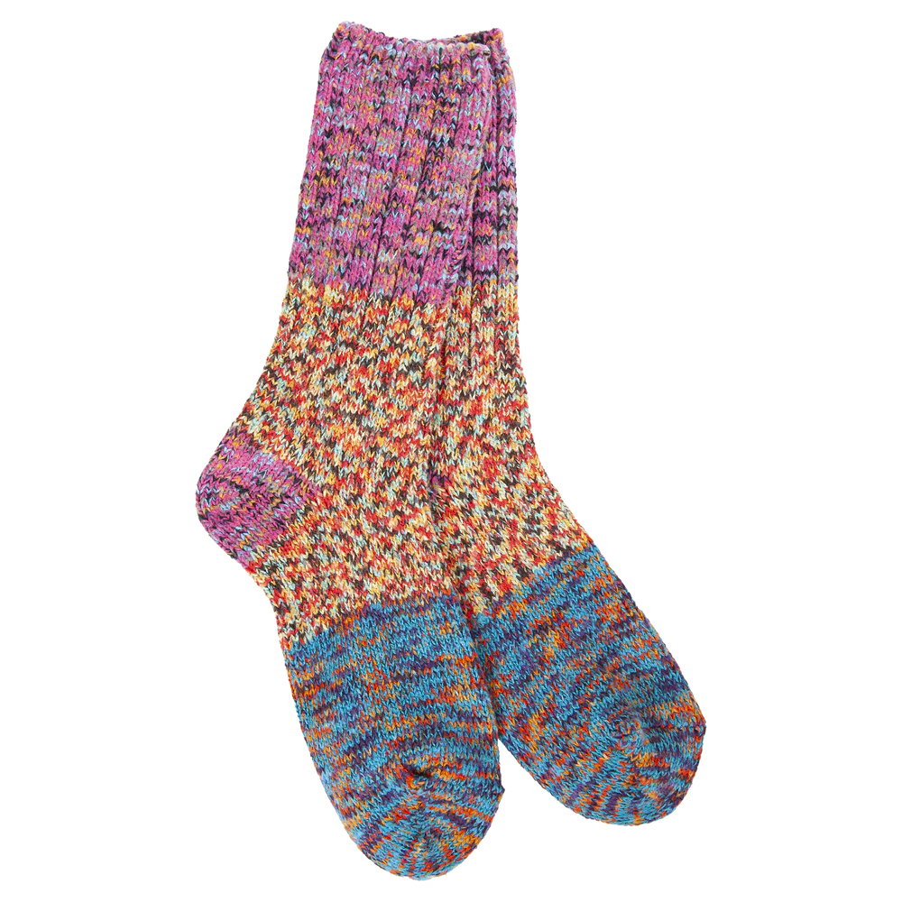 pair of socks knitted in hues of pink, orange, and blue.