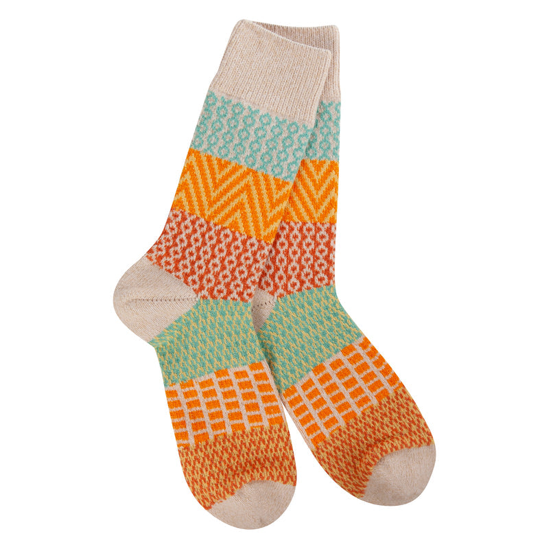 orange, mint, red, green and tan patterened socks on white background