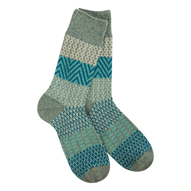 green, mint and blue patterned socks on white background