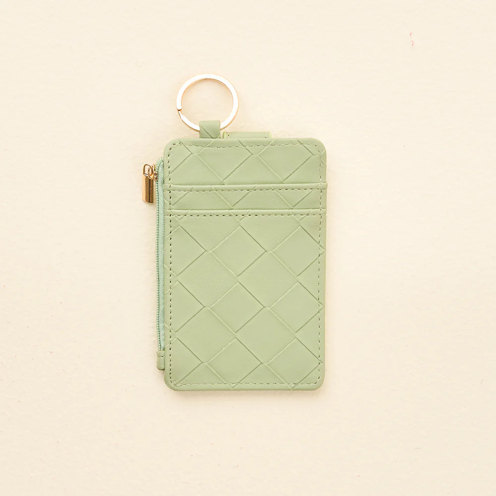 back view of sage Woven Keychain Wallet shown on a light beige background